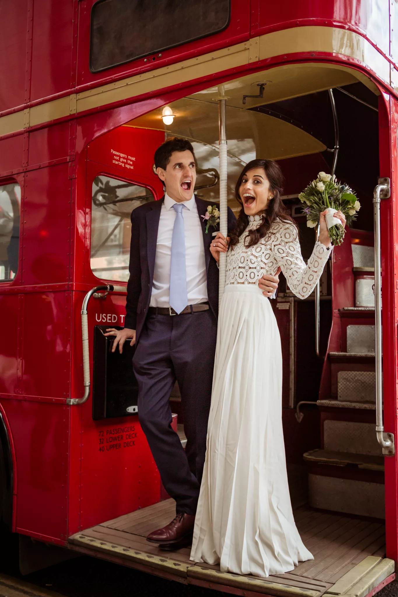 Wedding at Chelsea Old Town Hall London, red double decker bus Routemaster to reception at Winemakers Club Holborn