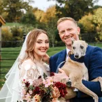 Bride and groom with a whippet at their wedding at Primrose Hill Farm, Banbury